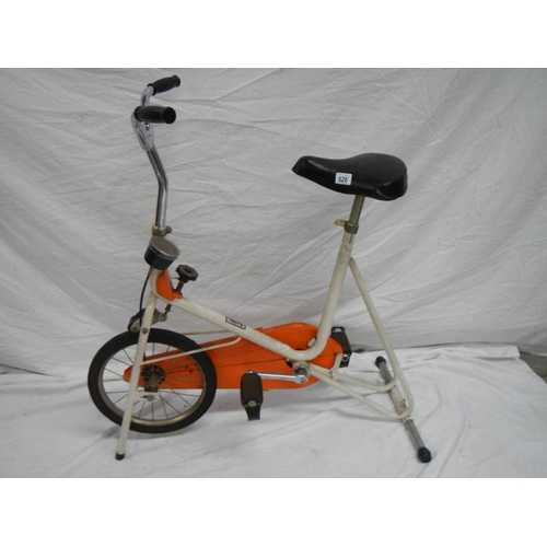 526 - A mid to late 20th century exercise bike.