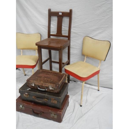 531 - A tall straight backed chair, 2 1960's vinyl chairs and 3 vintage suitcases.