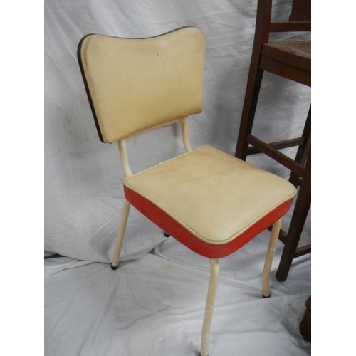 531 - A tall straight backed chair, 2 1960's vinyl chairs and 3 vintage suitcases.