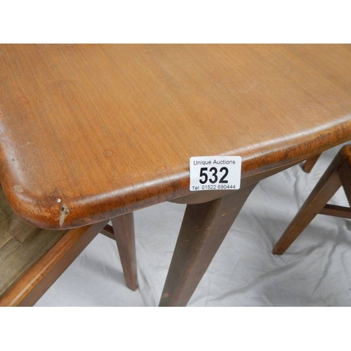 532 - An Ercol style extending table with 4 chairs in need of restoration, 175 x 74 cm x 175 cm high.