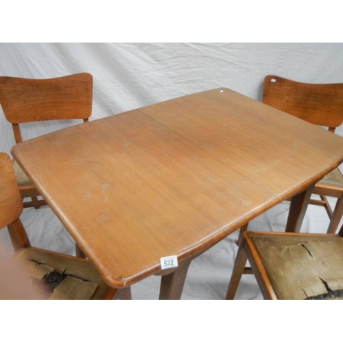 532 - An Ercol style extending table with 4 chairs in need of restoration, 175 x 74 cm x 175 cm high.