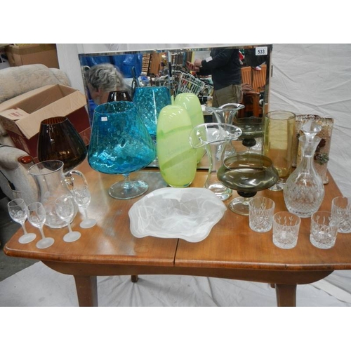 533 - A 4 shelf bathroom mirror (78 x 48 x 14 cm) and 8 pieces of coloured glass including decanter.