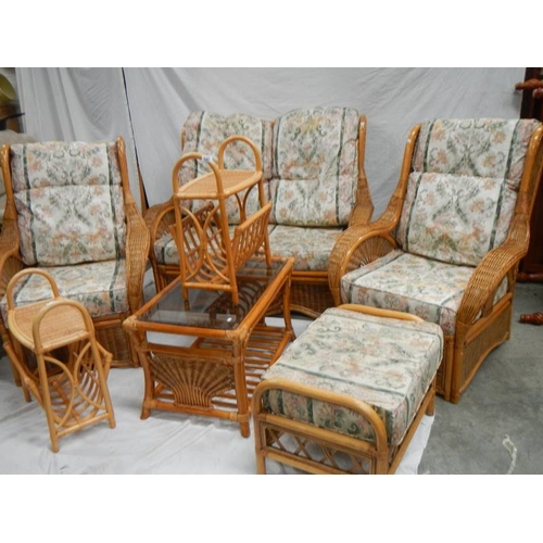 540 - A cane/whicker 7 piece suite with cushions.