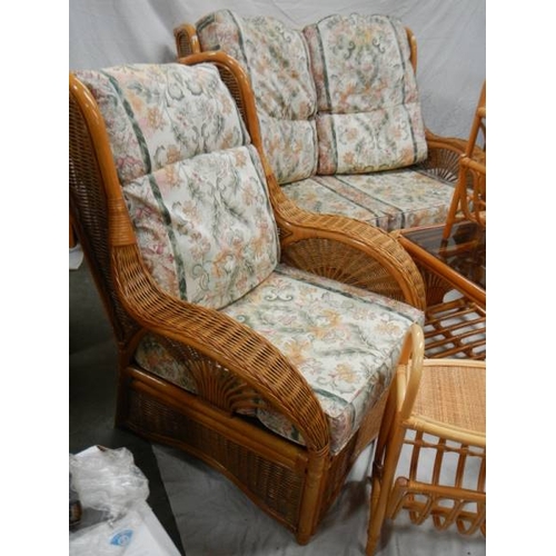 540 - A cane/whicker 7 piece suite with cushions.