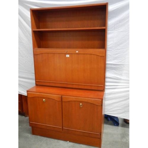 543 - A teak 3 door bedroom unit with lockable mirrored shelf with light, H 175 cm, W 100 cm, D 45 cm.