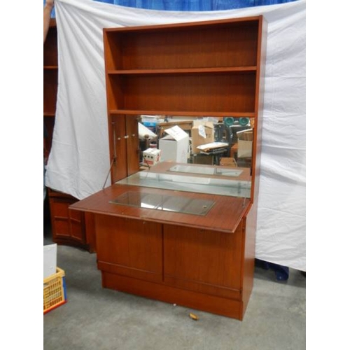 543 - A teak 3 door bedroom unit with lockable mirrored shelf with light, H 175 cm, W 100 cm, D 45 cm.