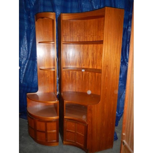 544 - A pair of teak corner cupboard/shelf units, the small having lighting,  1 x H 200 cm, W 100 cm, D 50... 