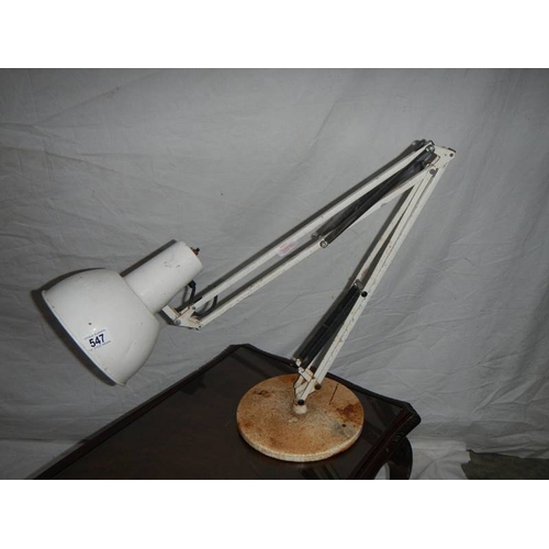 547 - A large white angle poise lamp with weighted bottom.