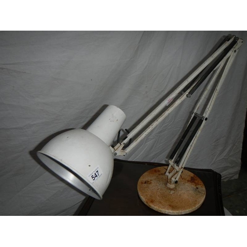 547 - A large white angle poise lamp with weighted bottom.