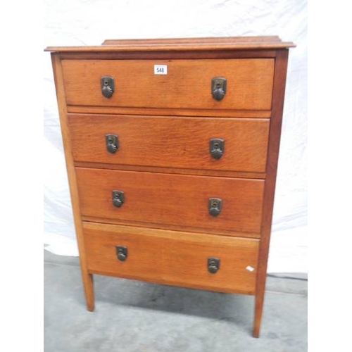 548 - A 4 drawer oak chest, H 107 cm, W 75 cm, D 43 cm.