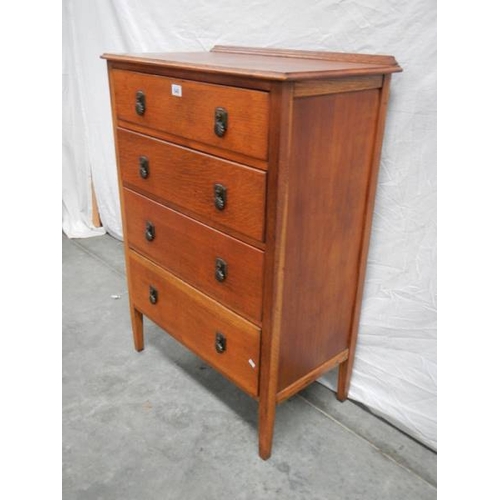 548 - A 4 drawer oak chest, H 107 cm, W 75 cm, D 43 cm.