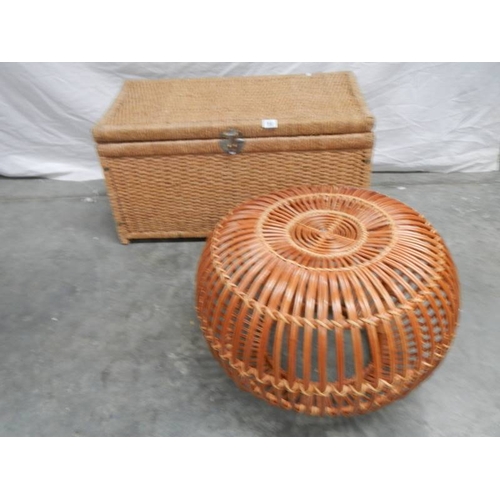 550 - A circular wicker table 63 cm diameter x 40 cm high and a rattan blanket box with hinged lid L 85 cm... 