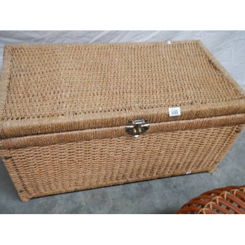 550 - A circular wicker table 63 cm diameter x 40 cm high and a rattan blanket box with hinged lid L 85 cm... 