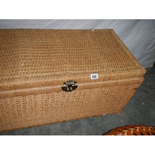 550 - A circular wicker table 63 cm diameter x 40 cm high and a rattan blanket box with hinged lid L 85 cm... 