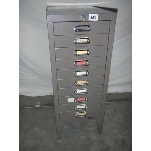 553 - A fine 10 drawer metal cabinet in gun metal grey with key, 72 x 42 x 29 cm.