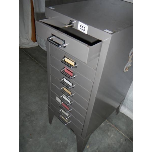 553 - A fine 10 drawer metal cabinet in gun metal grey with key, 72 x 42 x 29 cm.