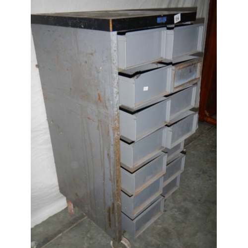 554 - A 14 drawer metal chest on wheels, 105 x 48 x 46 cm.