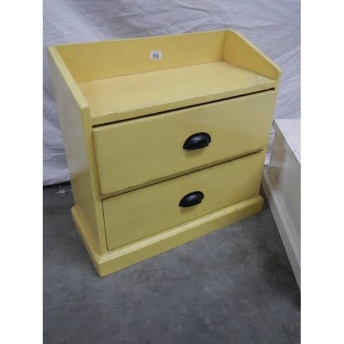 556 - A 2 drawer pine shelf unit in yellow and a pine chest in white.