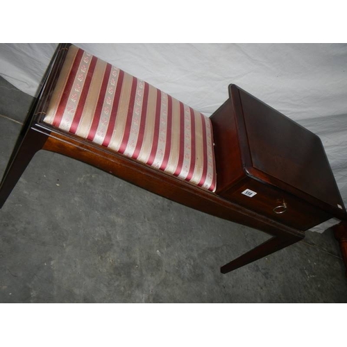 558 - A good red stripe telephone seat in good condition.