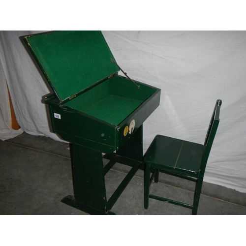 559 - A green painted pine school desk with chair in need of restoration/stripping.