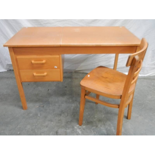 562 - An unusual office desk with 2 drawers, lift up writing slope and chair, 115 x 60 x 72 cm.