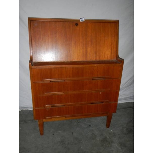 563 - A teak desk in good condition for age, 81 x 40 x 108 cm.