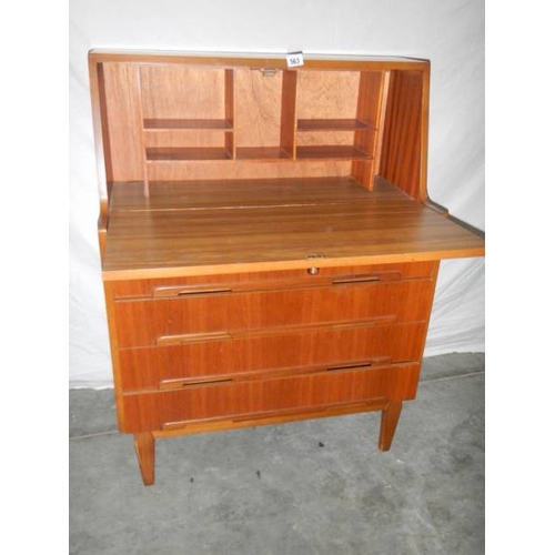 563 - A teak desk in good condition for age, 81 x 40 x 108 cm.