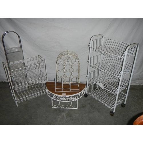 567 - Six white shelves, a wine rack and wheeled rack.