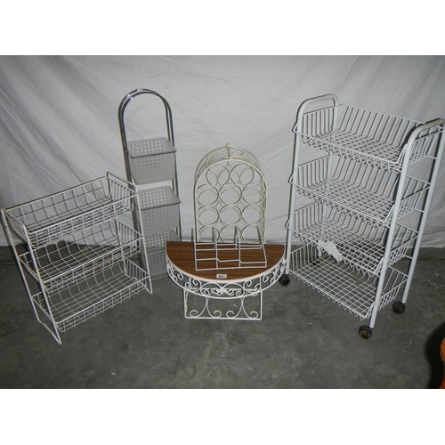 567 - Six white shelves, a wine rack and wheeled rack.