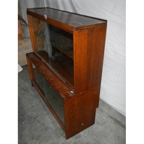 569 - A Wernick style glass fronted book case, H 71, W 53, D 47 cm.