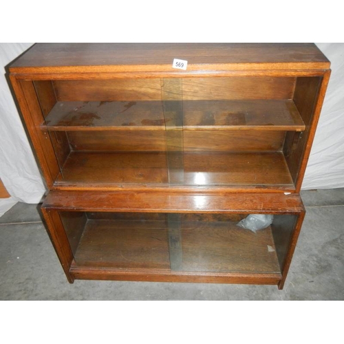 569 - A Wernick style glass fronted book case, H 71, W 53, D 47 cm.