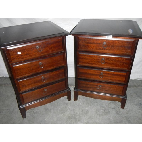 570 - A pair of Stag style 4 drawer bedside chests.