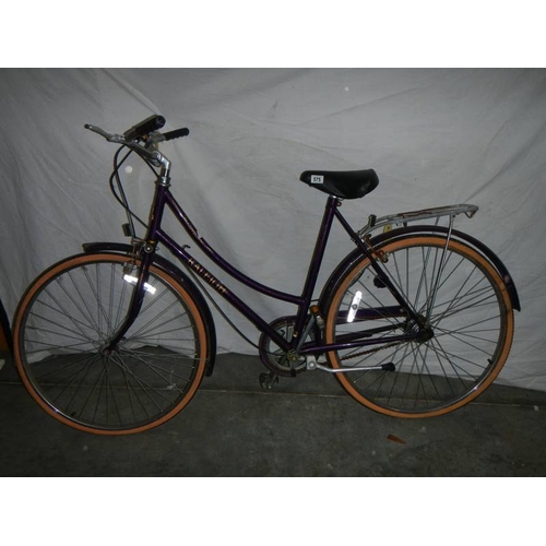 575 - A Raleigh ladies bicycle in purple, 3 speed ''Sturmey Archer'' with alloy back rack and alloy side s... 