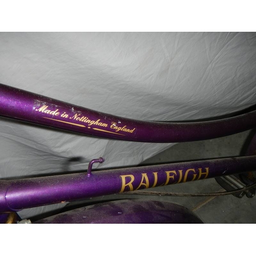 575 - A Raleigh ladies bicycle in purple, 3 speed ''Sturmey Archer'' with alloy back rack and alloy side s... 