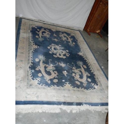 576 - A 5 dragon plush carpet in good condition but needs a clean, approximately 2 x 3 m.