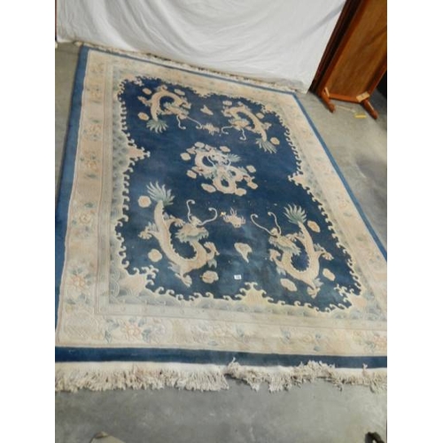 576 - A 5 dragon plush carpet in good condition but needs a clean, approximately 2 x 3 m.