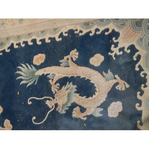 576 - A 5 dragon plush carpet in good condition but needs a clean, approximately 2 x 3 m.