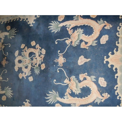 576 - A 5 dragon plush carpet in good condition but needs a clean, approximately 2 x 3 m.