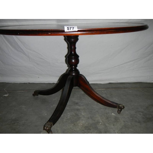 577 - A good circular mahogany table with string inlay, 74 cm diameter.