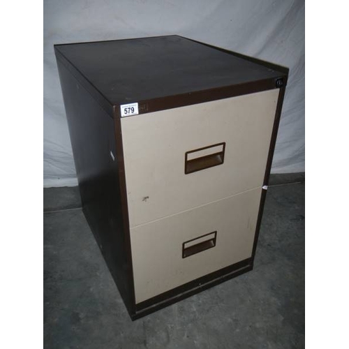 579 - A 2 drawer metal filing cabinet.