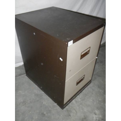 579 - A 2 drawer metal filing cabinet.