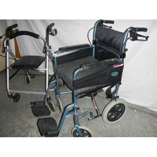 583 - A ''Dav's'' folding wheelchair with foot rests and a walking aid.