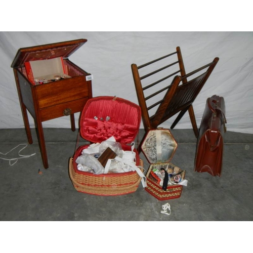 598 - A sewing box on legs, an oak magazine rack, an old leather briefcase and 2 wicker sewing baskets.