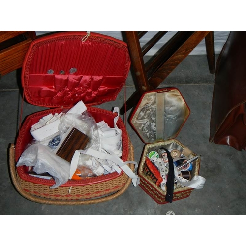 598 - A sewing box on legs, an oak magazine rack, an old leather briefcase and 2 wicker sewing baskets.