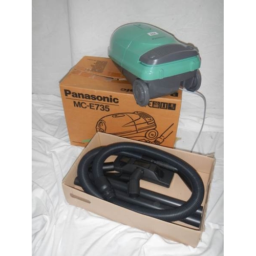 604 - A new (still in box) Panasonic MC-E735 vacuum cleaner with all tools and extra bags.