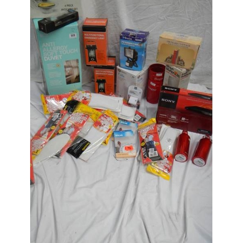 609 - A large lot of miscellaneous items including DVD player, Kettle, Quilt etc.,