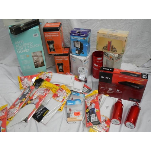 609 - A large lot of miscellaneous items including DVD player, Kettle, Quilt etc.,