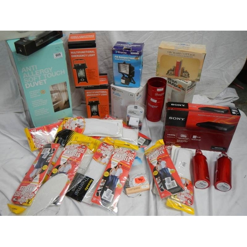 609 - A large lot of miscellaneous items including DVD player, Kettle, Quilt etc.,