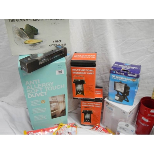 609 - A large lot of miscellaneous items including DVD player, Kettle, Quilt etc.,