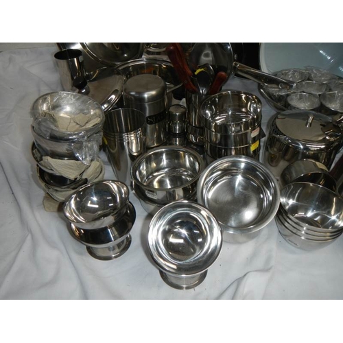 610 - A fantastic array of stainless steel pans, bowls etc including a Swan urn.